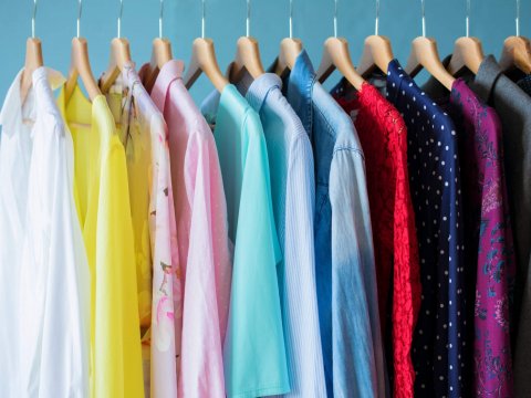 Women clothes hanging in row in closet